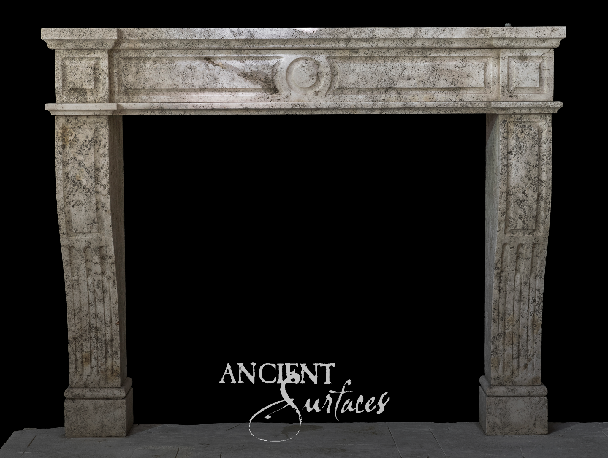 Grey mottled limestone fireplace mantel with a paneled frieze, carved ring roundel and curved jambs fluted on their lower half