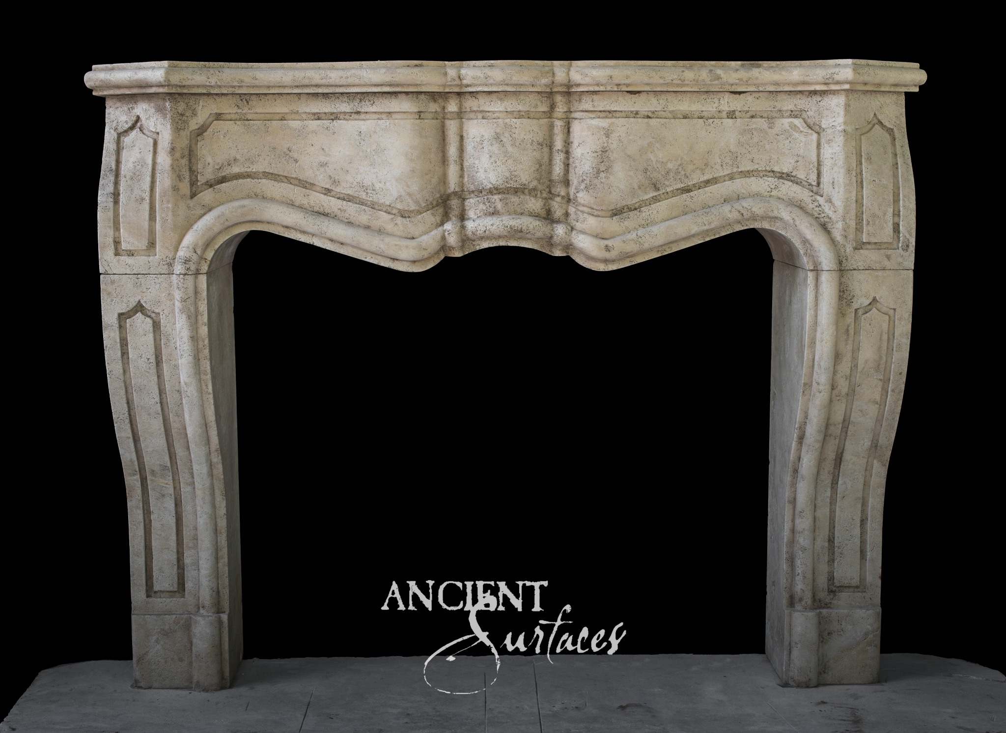 Cream limestone fireplace mantel with a molded serpentine arched opening and shaped recessed panels on the frieze and jambs